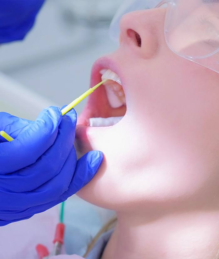 Child receiving fluoride treatments