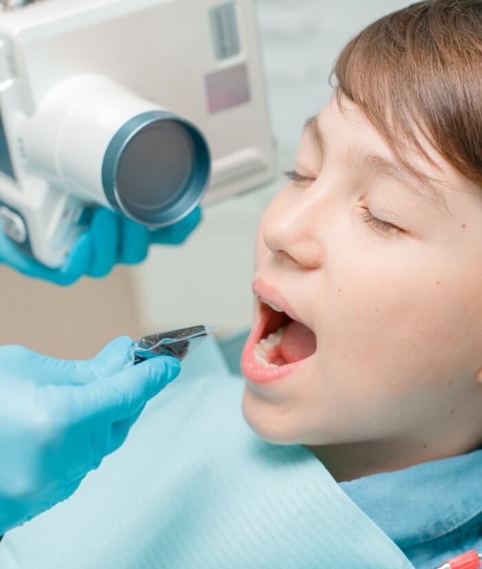Child receiving dental bonding