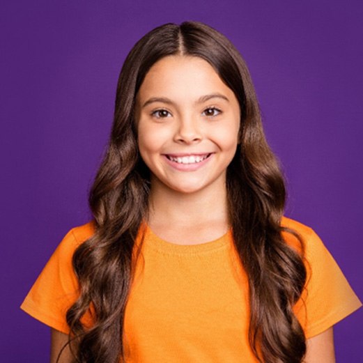 Girl smiling with tooth-colored fillings in Papillion 