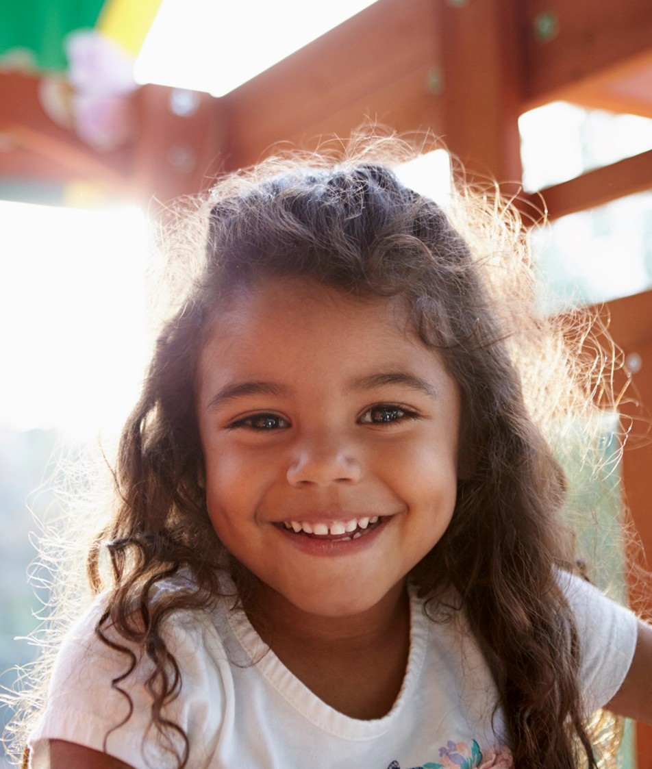 Little girl smiling after visiting emergency dentist in Papillon, NE