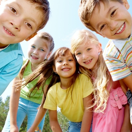 Group of children smiling after receiving pediatric dental services in Papillion Nebraska