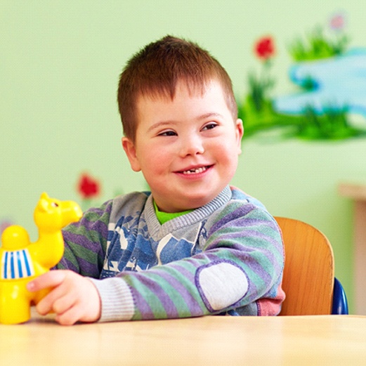 young boy with healthy smile thanks to special needs dentistry in Papillion