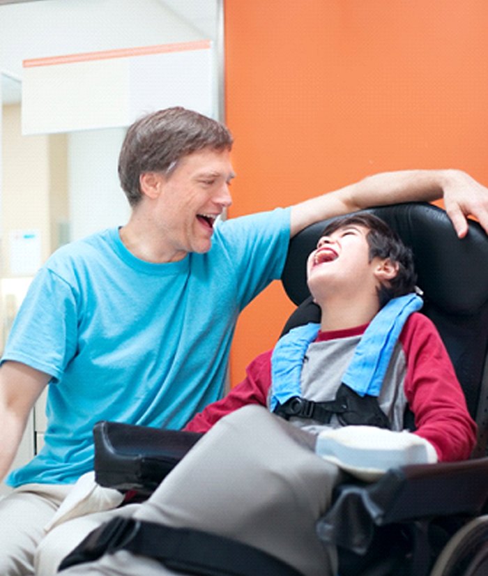 Special needs dentist in Papillion working with laughing child