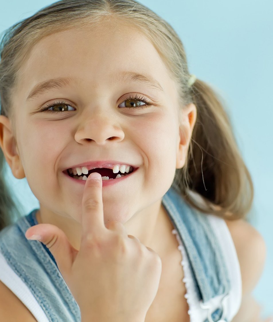 a toddler smiling after visiting their pediatric dentist in Papillion