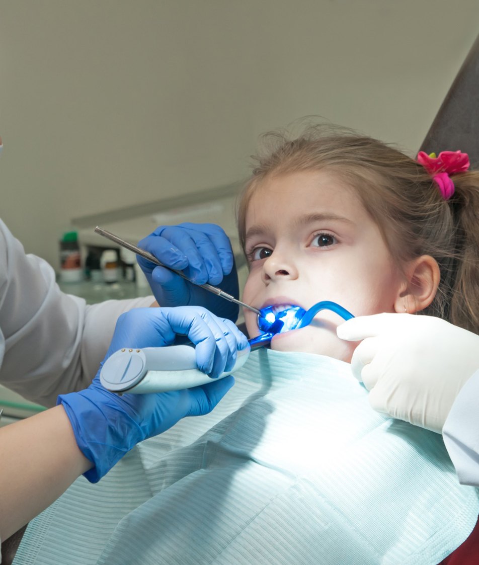 a toddler undergoing treatment from pediatric dentist in Papillion