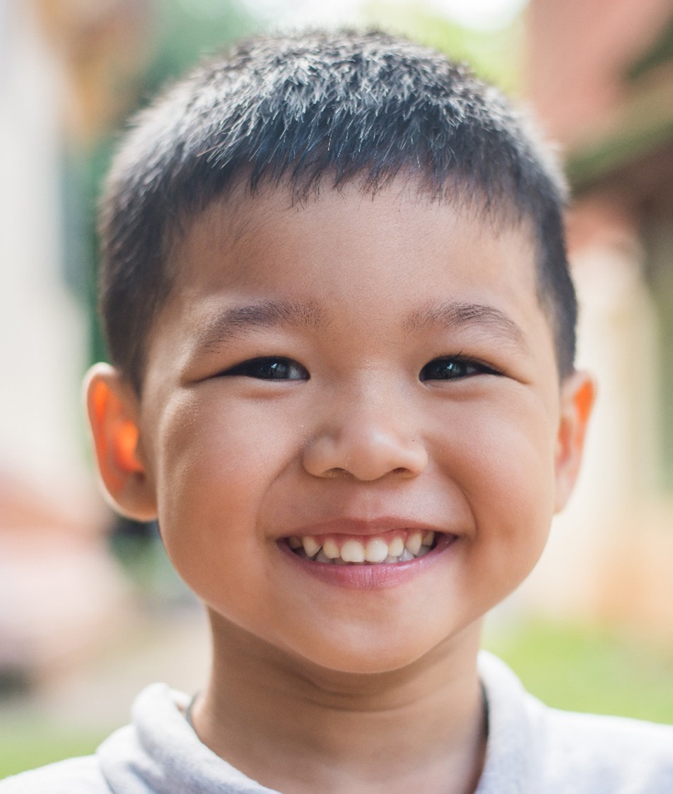 a toddler smiling before visiting their pediatric dentist in Papillion