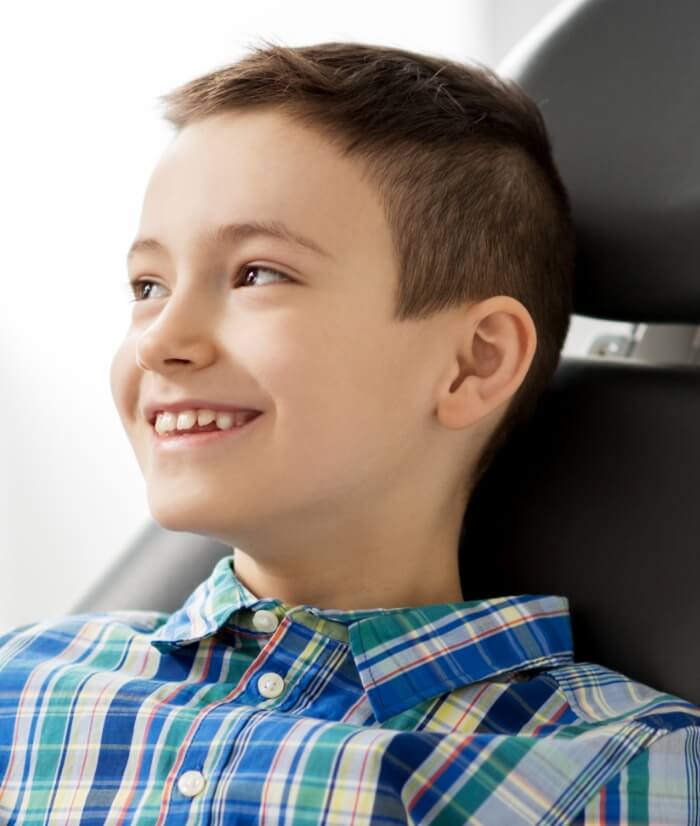 Young patient smiling during dentistry for children visit