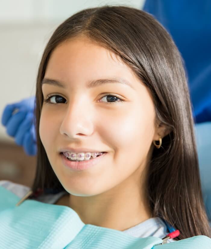 Young person smiling during dentistry for teens visit