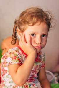 Young girl with dental pain