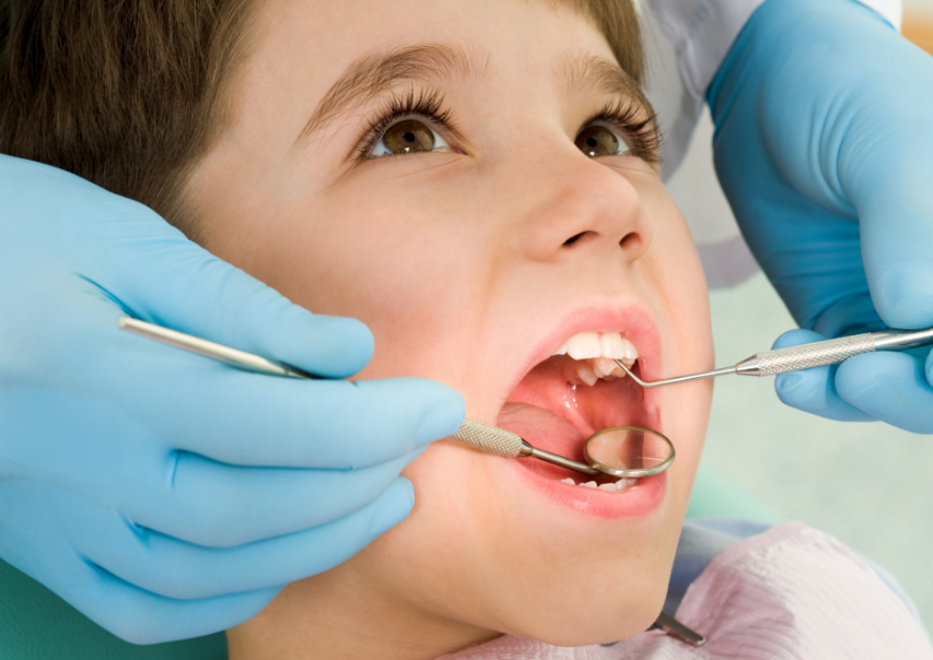 Child undergoing dental exam